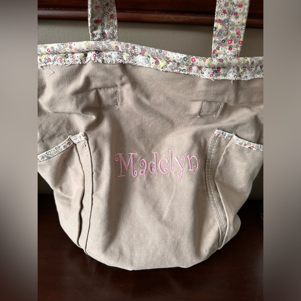 Thirty one tote with Madelyn embroidered on it